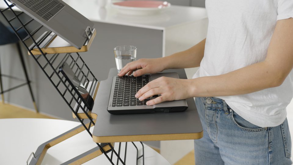 Mousetrapper standfriend in use with a laptop set up. close up image of keyboard platform with a keyboard in use