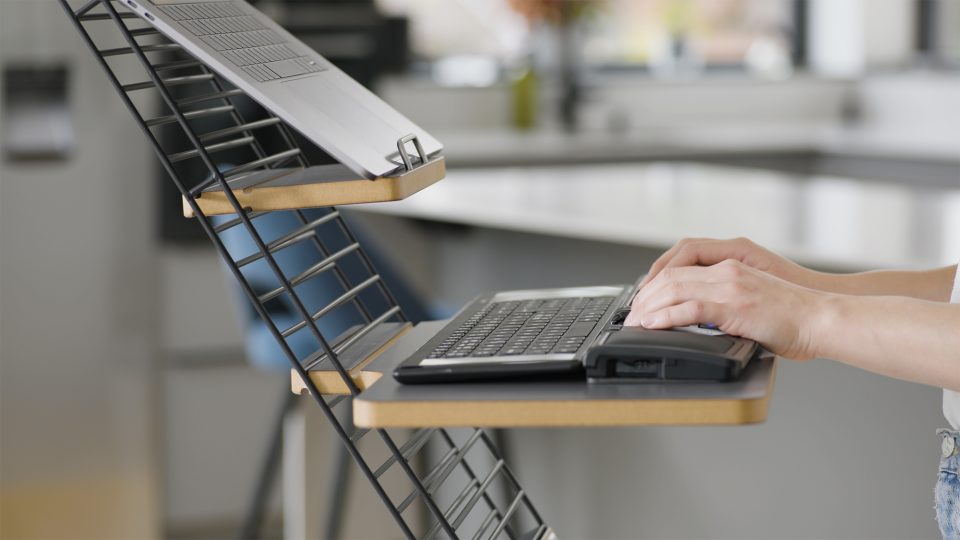 Mousetrapper standfriend in use with a laptop set up. close up image of keyboard platform with a keyboard in use