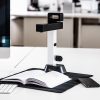 IRIScan Desk 6 set up on a white desk, scanning a book