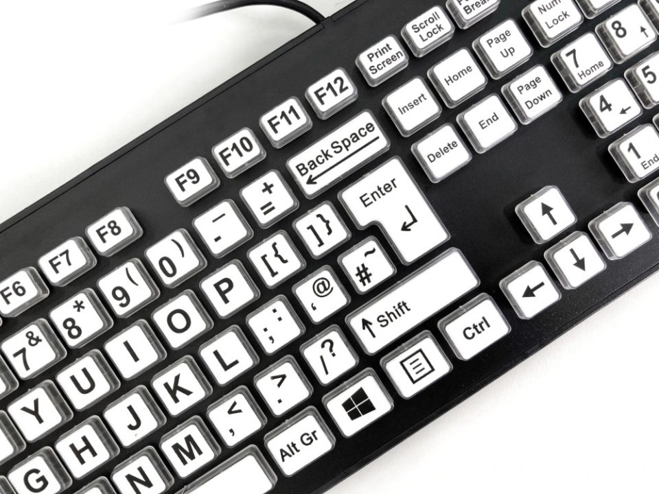 closeup shot of High Contrast Large Legend Keyboard features bold black text on white keys