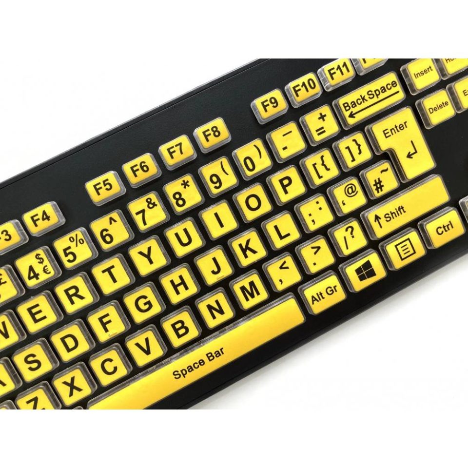 High Visibility Large Legend Keyboard features bold black text on yellow keys. angled close up picture