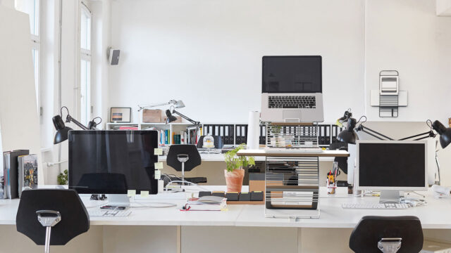 Mousetrapper standfriend in use with a laptop set up. in a standard office environment