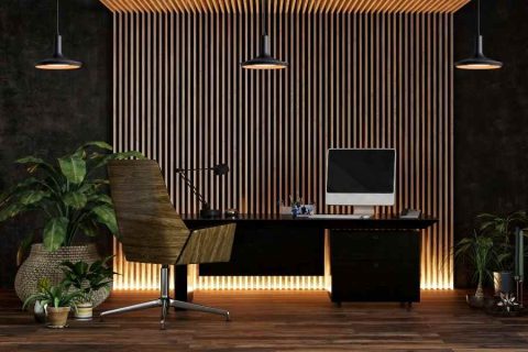 Modern home office with desk, plants, and office ambient lighting.