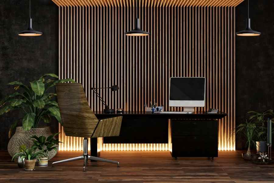 Modern home office with desk, plants, and office ambient lighting.