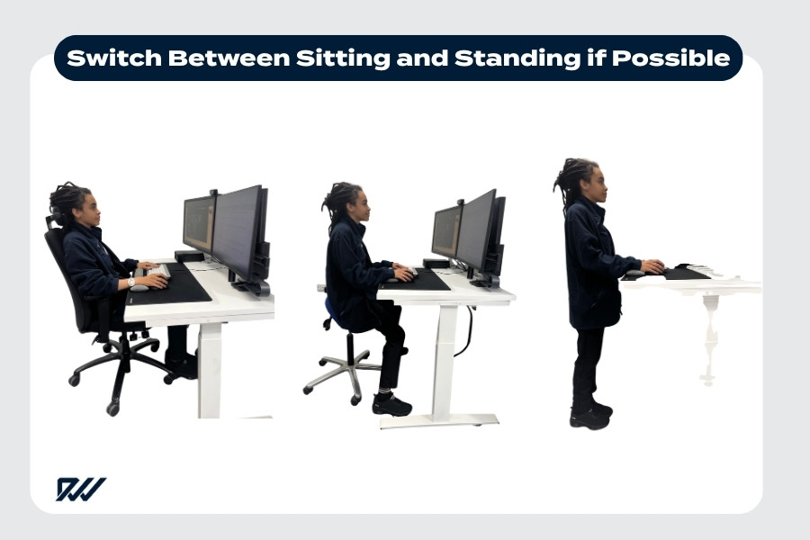 Person alternating between sitting and standing at an adjustable desk.