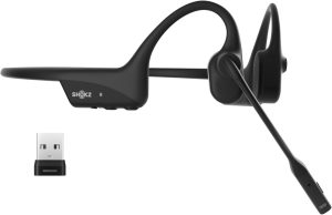 Side view of the Shokz OpenComm2 UC bone conduction headset with attached boom microphone and USB-A wireless adapter