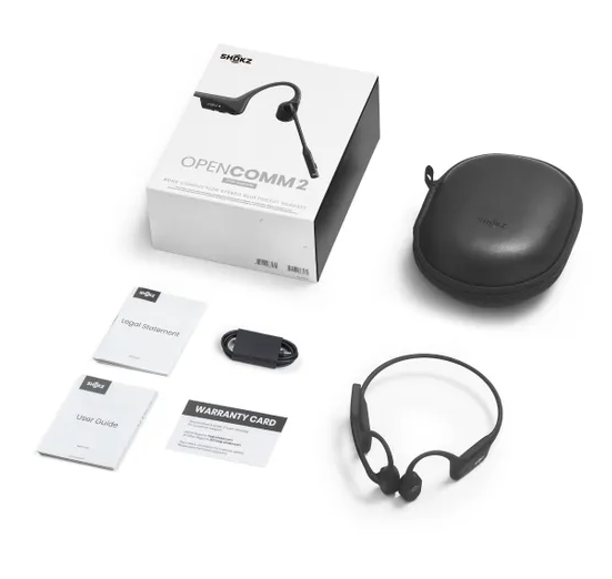 Shokz OpenComm2 UC full box contents including headset, USB-A adapter, carry case, manuals, and charging cable