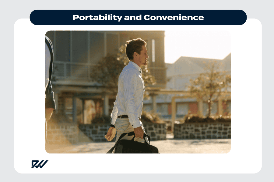 Person walking outdoors carrying a laptop bag, suggesting portability and ease of working while on the move.
