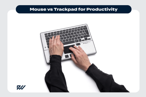 Top-down photograph of hands using a laptop keyboard and trackpad, illustrating productivity with a trackpad.