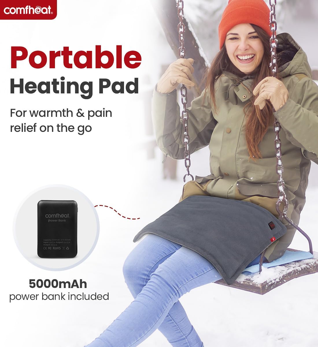 Comfheat Rechargeable Heating Pad being used across a person's lap outdoors with the included portable power bank.