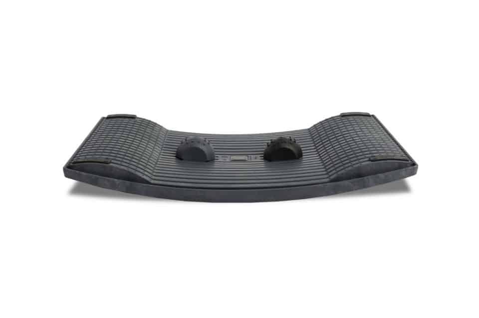 Gymba balance board shown from the front, featuring curved ergonomic base and raised balance domes for active standing at a desk.