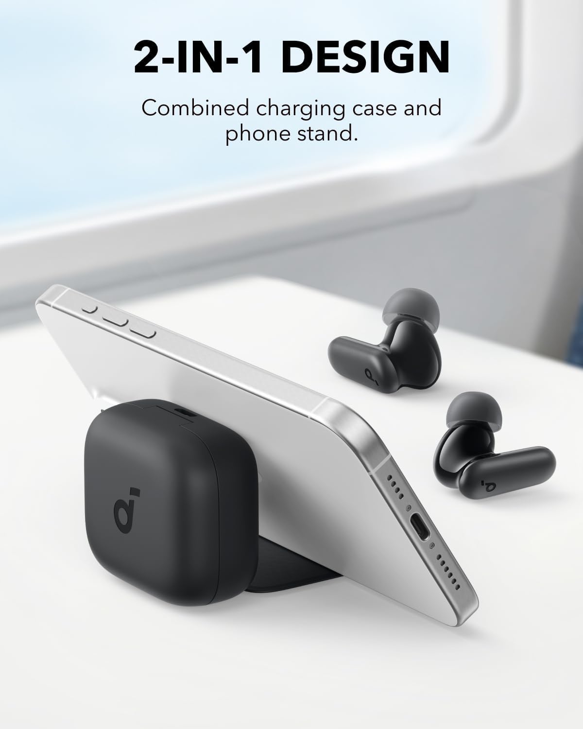 Soundcore Anker P30i wireless earbuds beside their charging case, which is being used as a stand for a smartphone.