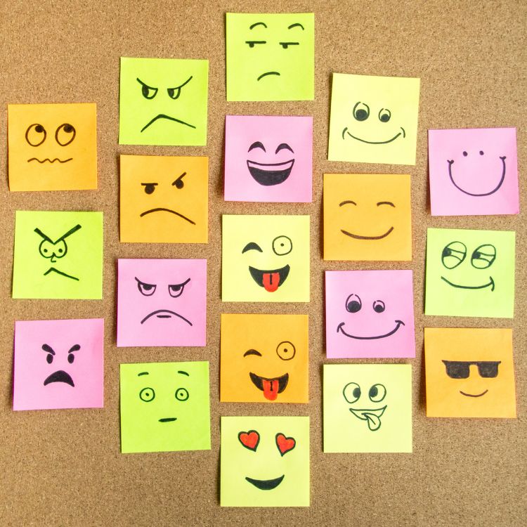 Colourful sticky notes displaying different emotions through hand drawn facial expressions.